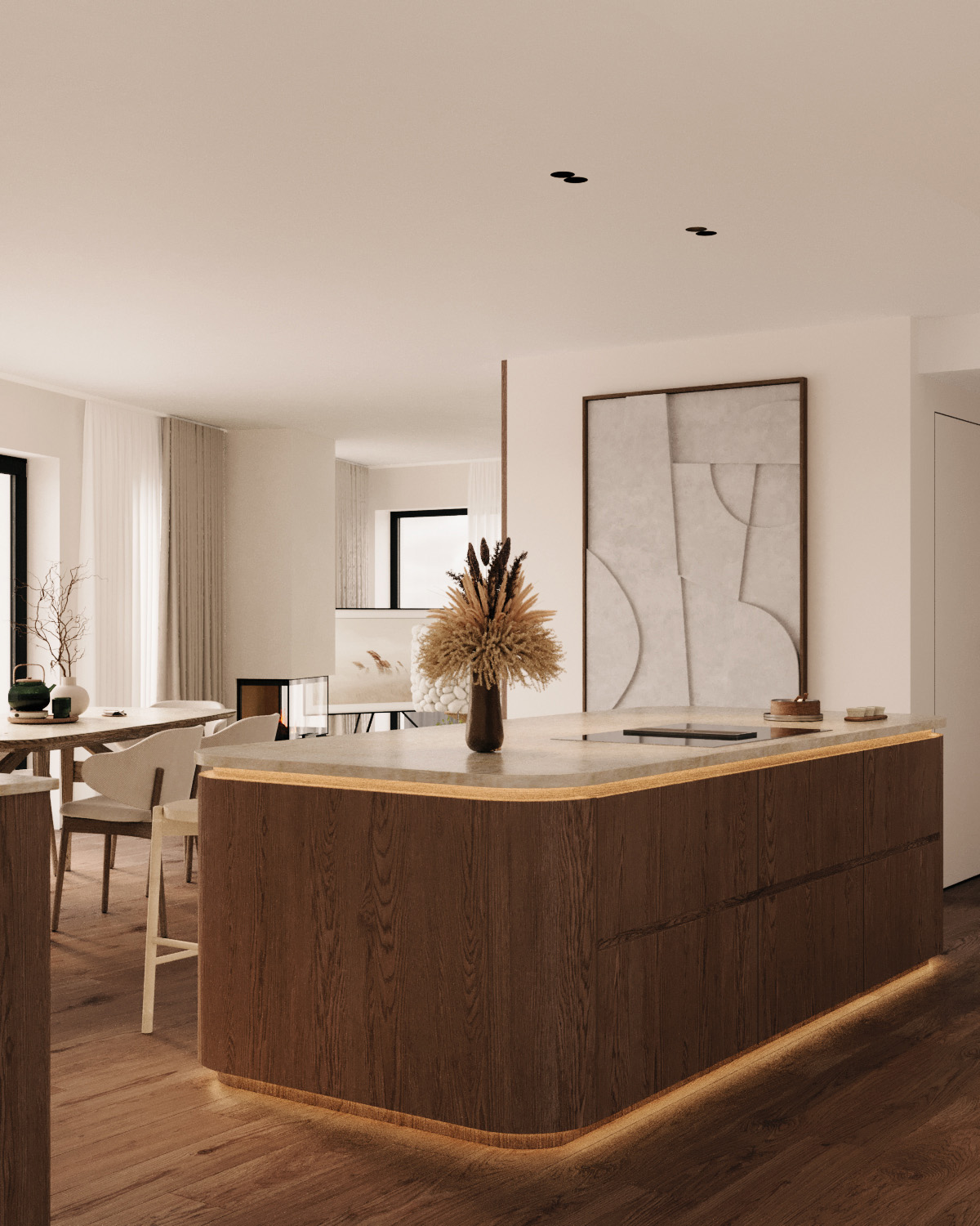 Stiligt - exklusivt kök med rundade former Modernt kök med en träö, minimalistisk inredning och ett konstverk på väggen. Ljusa trägolv och vita väggar skapar en stiligt luftig atmosfär. Matsalen syns i bakgrunden.